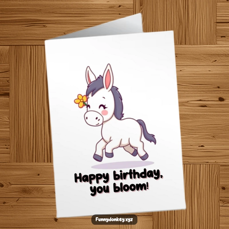 Funny free printable birthday card showing a kawaii donkey happily trotting with a flower in its mane, spreading joy.